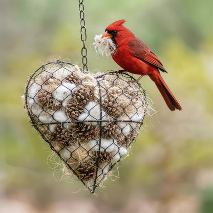 Hartvormige houder voor nestmateriaal voor vogels met natuurlijke nestvezels